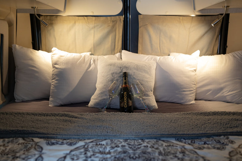  well-lit space.|Cozy RV rental bed with champagne — photo 17