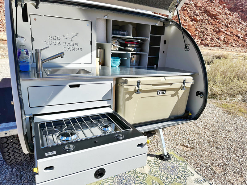 Teardrop RV rental's rear galley: sink, pull-out stove, & Yeti cooler for easy outdoor cooking & camping adventures. — photo 9