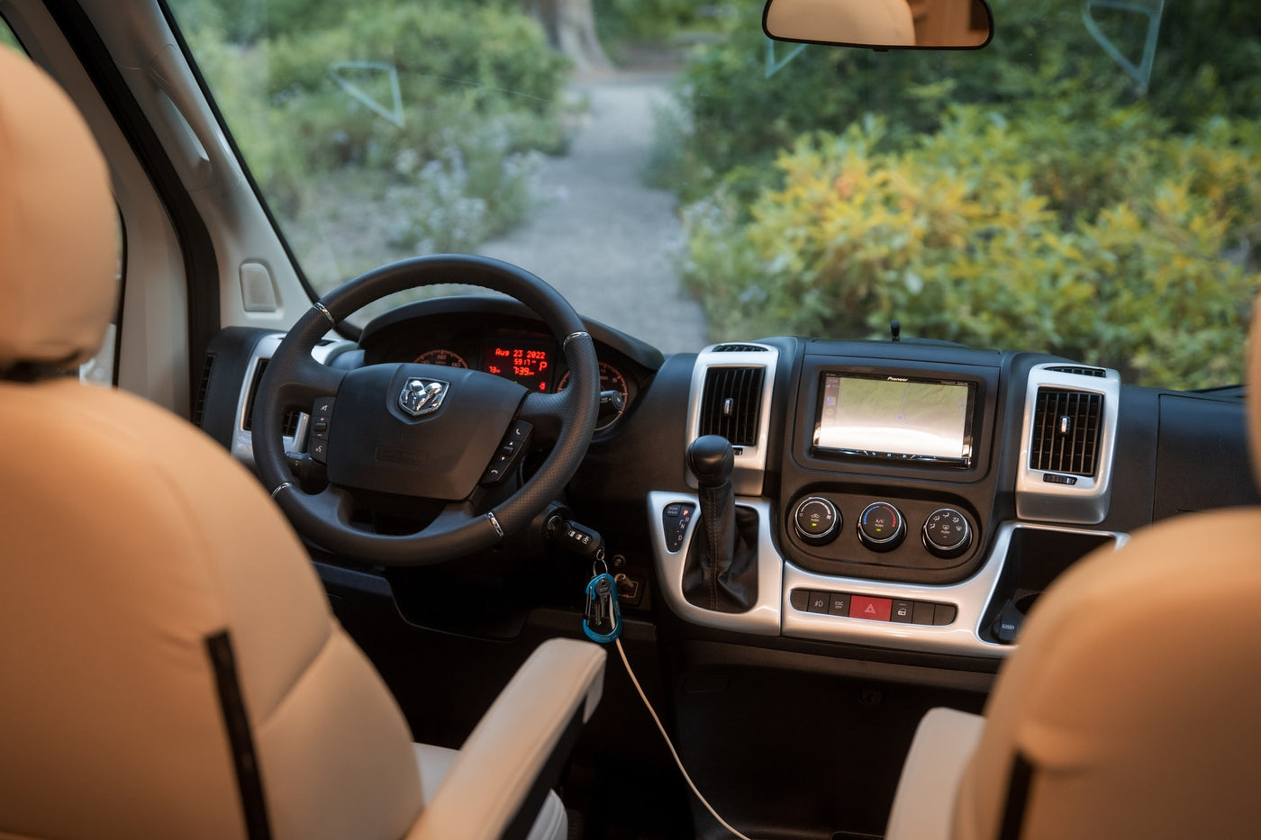 RV rental cockpit: steering wheel, nav display, and controls dated Aug 23, 2022, ready for your road trip. — photo 15