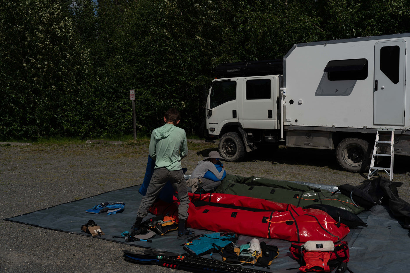 Rear view of the Isuzu NPR rig with packrafts and gear staged — photo 5