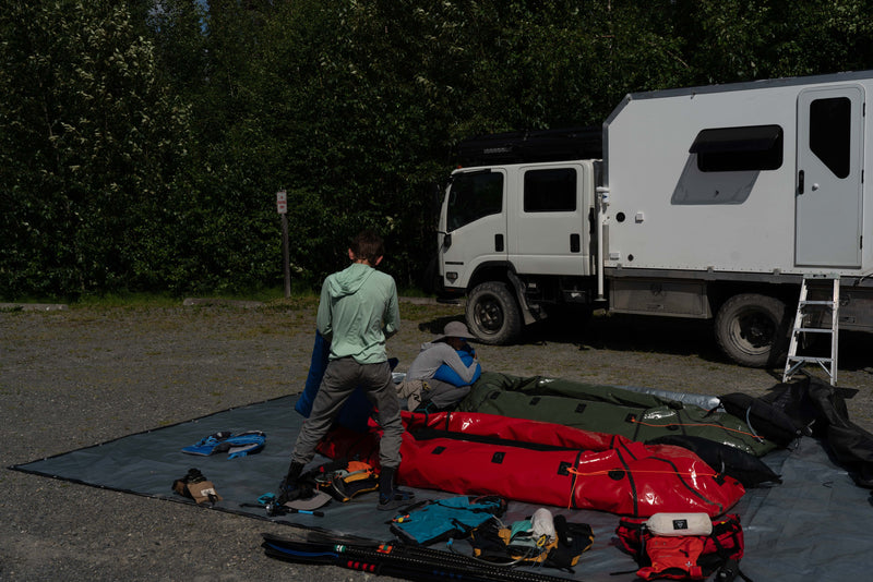 Rear view of the Isuzu NPR rig with packrafts and gear staged — photo 5