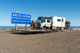 The rig at the Arctic Ocean sign in Tuktoyaktuk