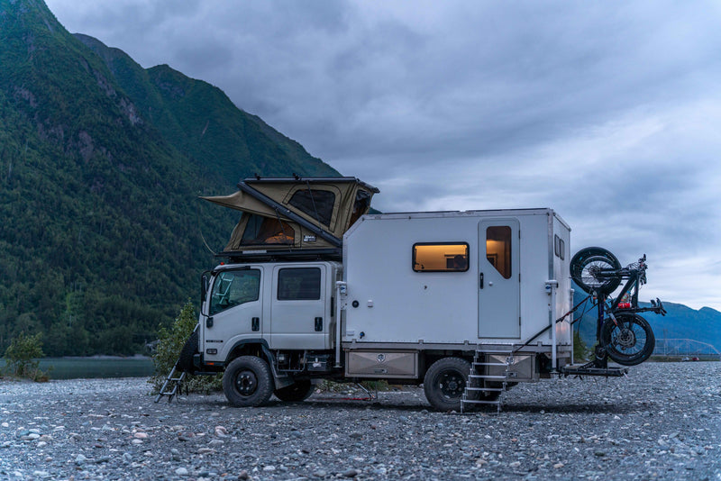 The rig camped along a river valley — photo 16