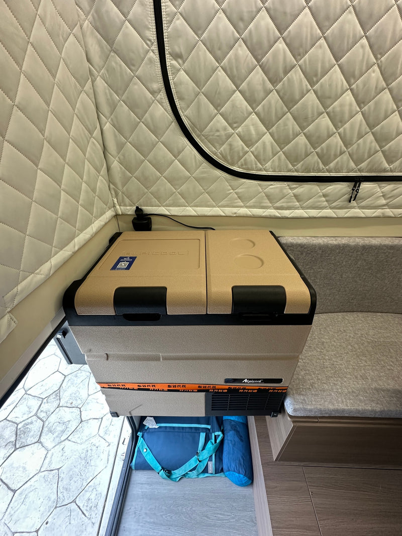  perfect for an RV rental adventure.|Cozy RV rental interior featuring a bed with vibrant citrus sheets — photo 8