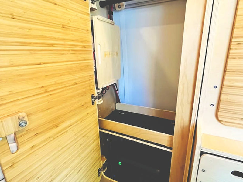  and a cozy bed.|Inside a compact **rv rental**: custom wood paneling — photo 16