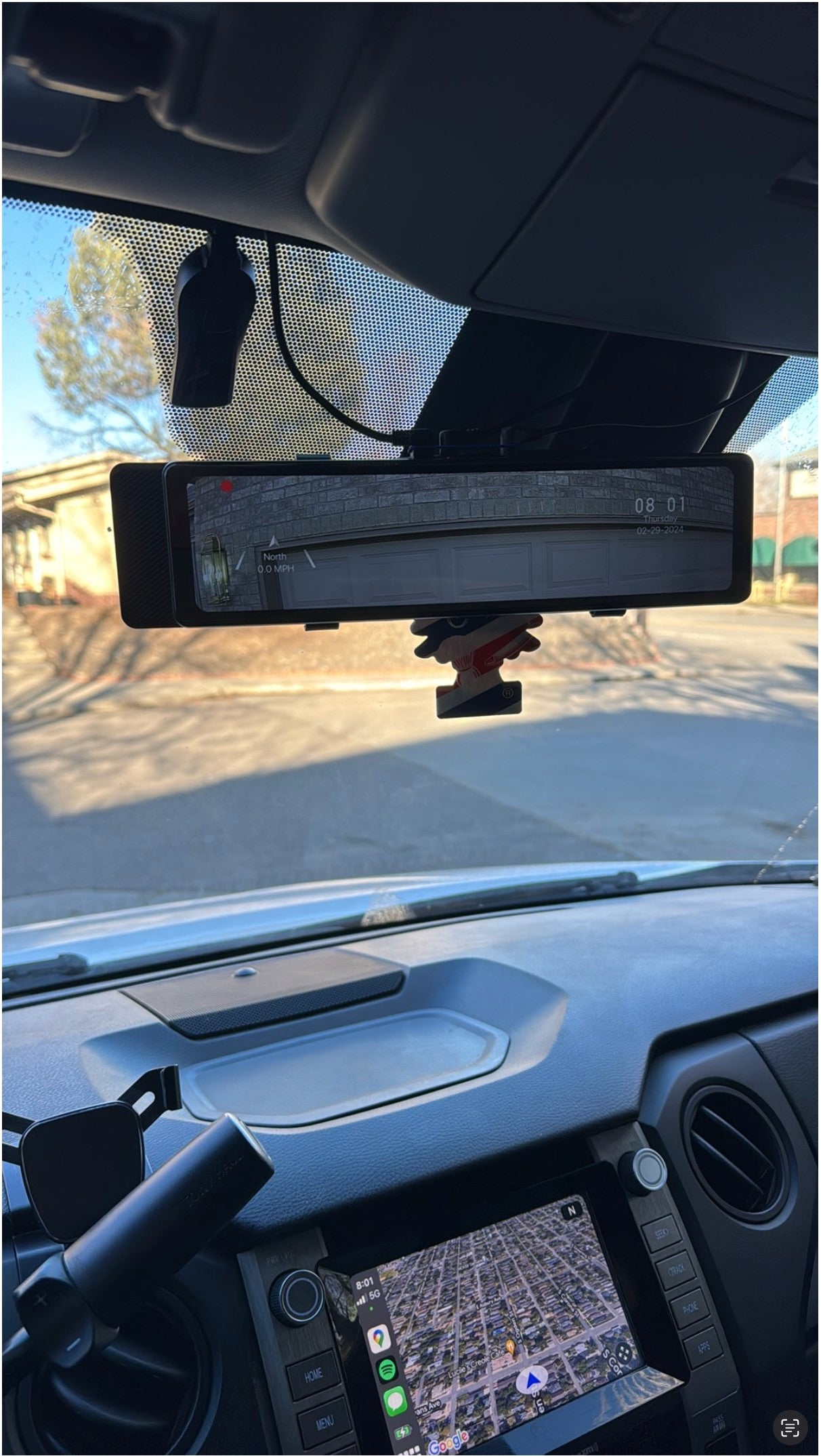 RV rental interior view: dashcam mirror displays road, while nav screen guides the route. Perfect for travel.