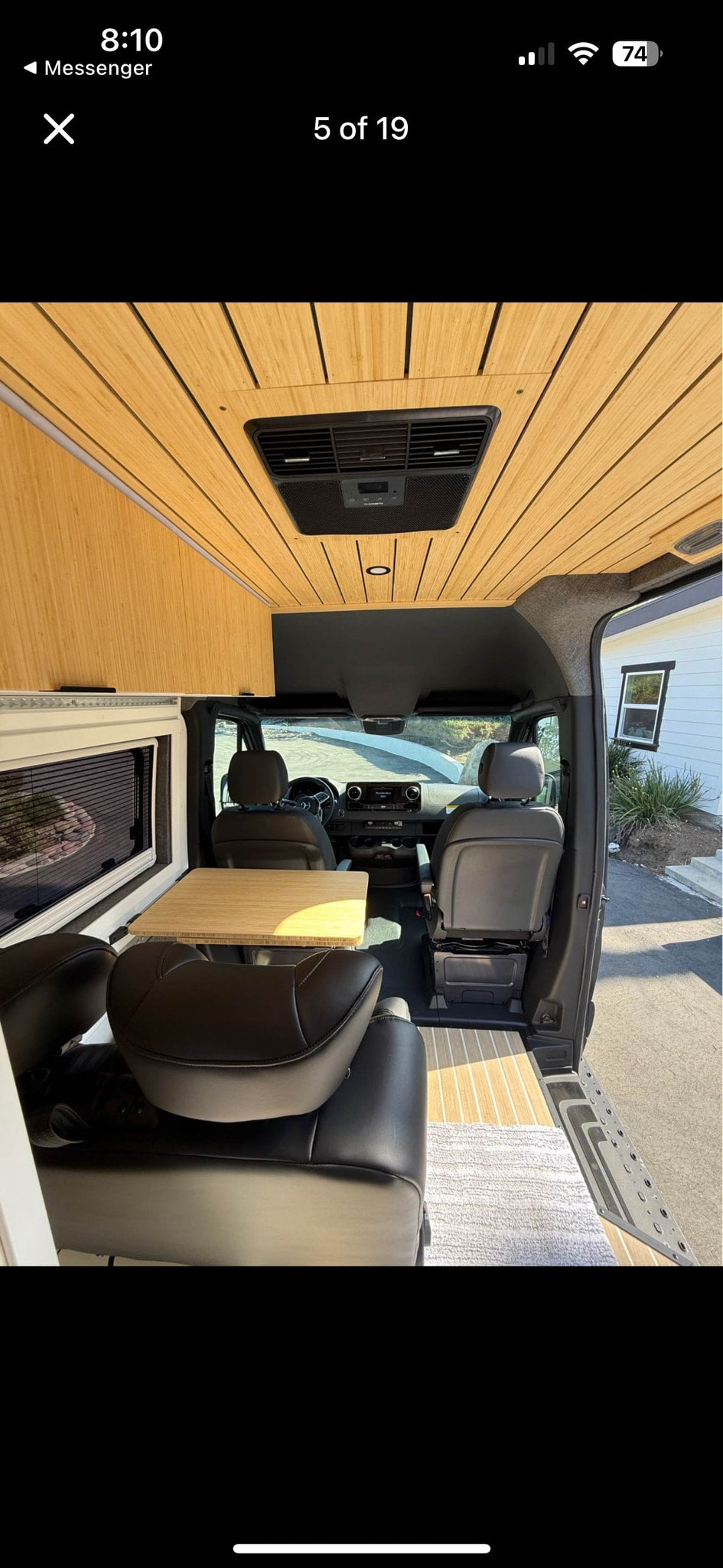  and a distant surfer create a serene scene.|Modern RV rental interior: bamboo ceiling — photo 3