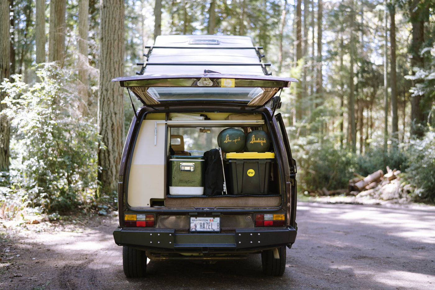 parked in a sunny forest. Perfect for RV rental.|Front view of a Westfalia camper van — photo 4
