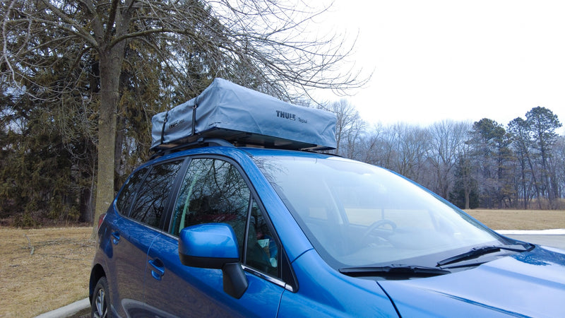 This blue SUV features a Thule Tepui roof-top tent, offering a flexible alternative to an RV rental for outdoor adventures. — photo 10