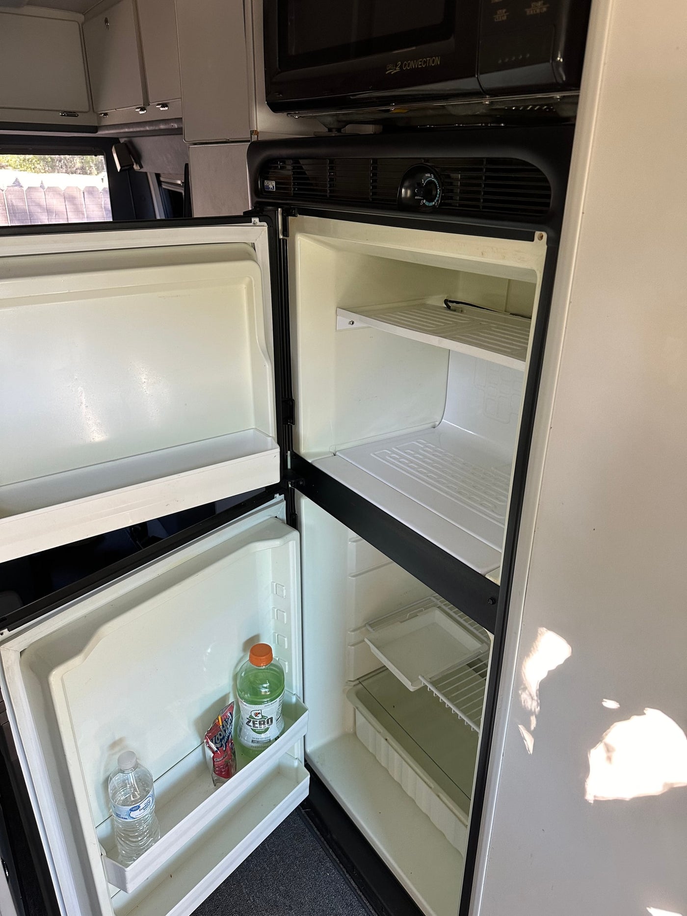  and a fitted cutting board. Perfect for travels.|RV rental: Spacious interior from rear — photo 10