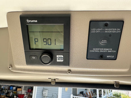 RV rental interior: Truma control panel displays "P 901" alongside a WFCO inverter remote ON/OFF switch.