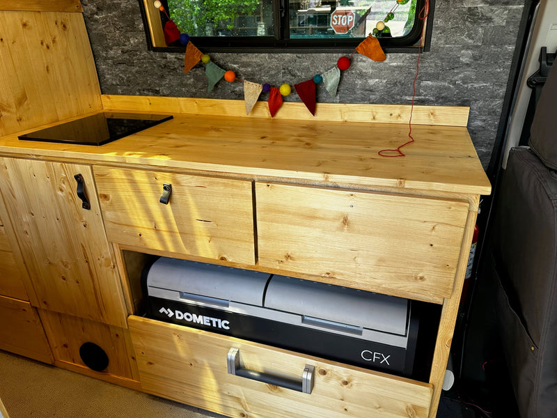  ready for adventure.|RV rental interior: dining area with wood table — photo 10