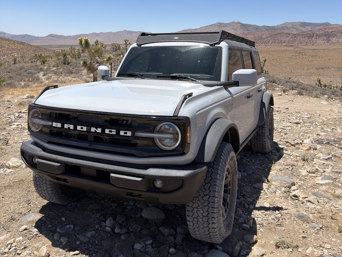  perfect for an off-road rv rental experience under clear skies.|Ford Bronco on rugged desert trail — photo 3