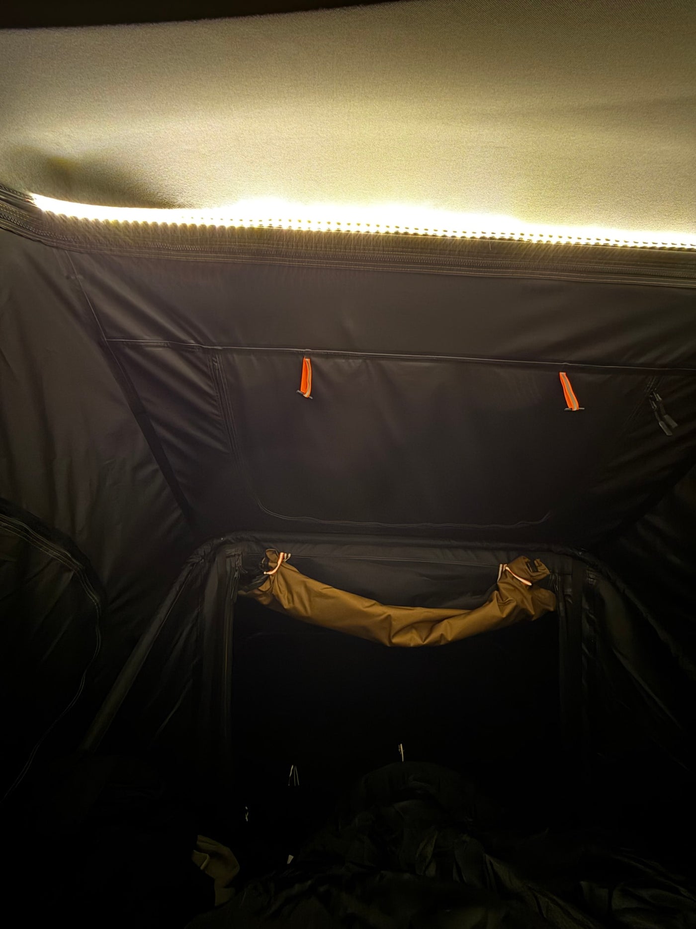  showing a dark padded sleeping area — photo 11