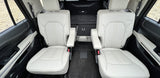 Spacious vehicle interior, ideal for rv rental. Two comfortable captain's chairs with armrests and ample rear cargo space.