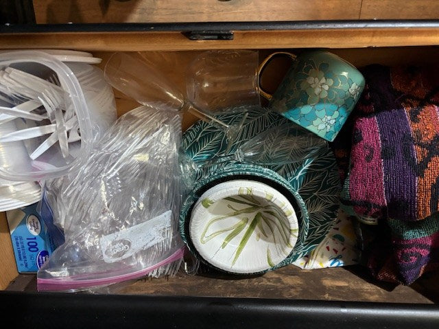  and a small trash can with liner on wood flooring.|Open portable fridge for an RV rental — photo 9
