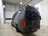 Rear view of a dark gray Mercedes-Benz Sprinter camper van with a bike rack, ideal for an rv rental.