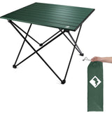 A dark green portable camping table with its carry bag, ideal gear for your RV rental trips.
