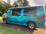 Explore with this vibrant ocean-themed van, an RV rental featuring clownfish, sea turtles, and flowing blue waters.
