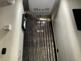 RV rental interior: ceiling AC, modern LED strip lighting, and blackout blinds for comfort and privacy.