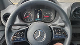 Dashboard of a Mercedes-Benz Sprinter, an RV rental, showing gauges, DEF level, and steering wheel with controls.