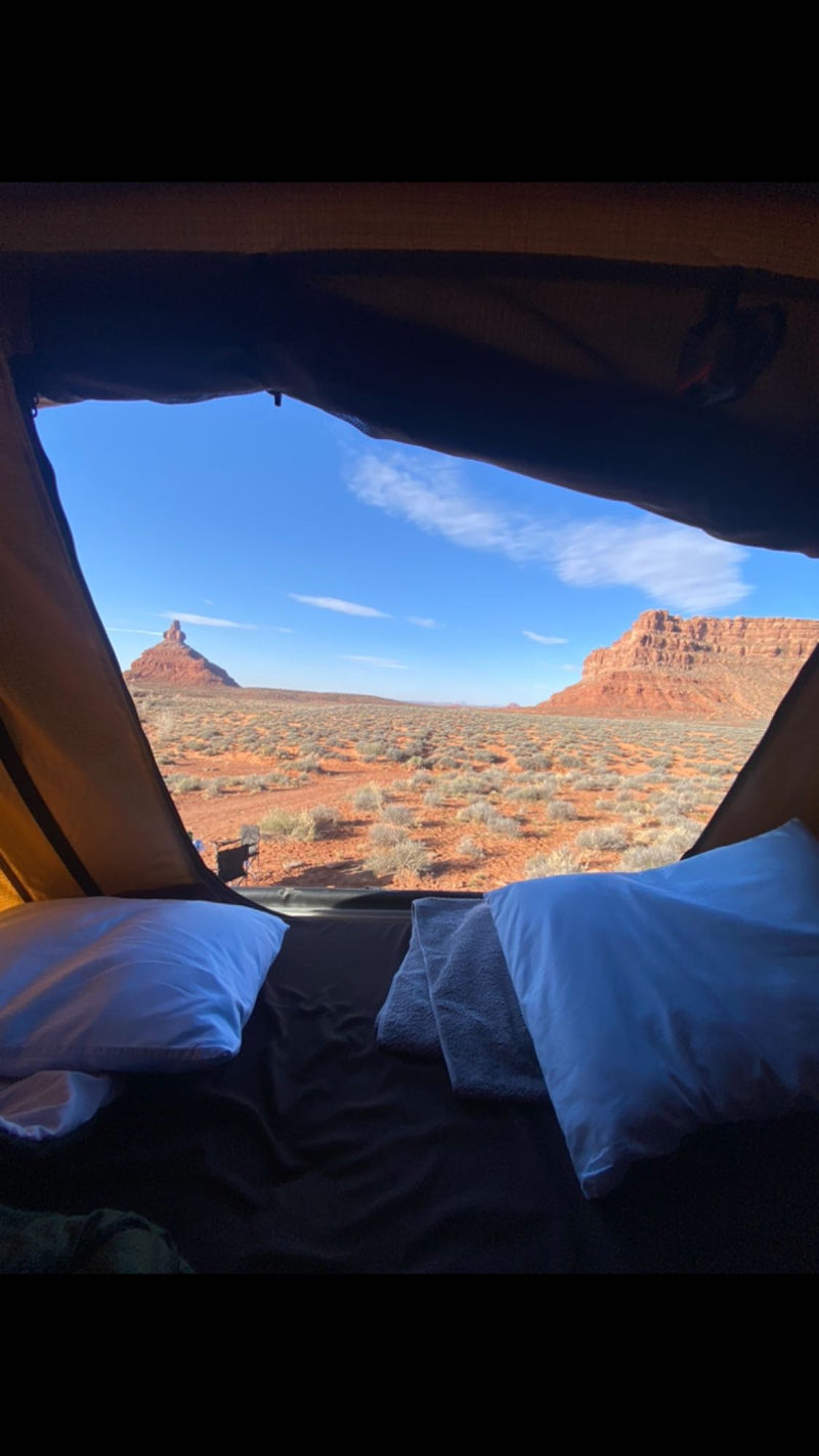  creating a cozy bed for car camping. It's like a compact RV rental experience.|RV rental: Vehicle interior featuring a comfortable bed setup — photo 16