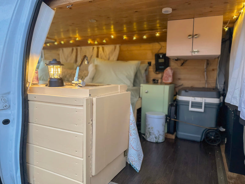  and storage. Ideal for rv rental.|Step inside this cozy RV rental: a converted van featuring a sleeping area — photo 9