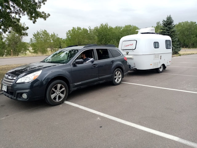  parked at a sunny campsite. Ideal for an rv rental adventure.|This teardrop RV rental camper