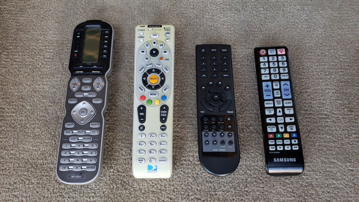 Four remote controls for electronics, useful in any home or RV rental entertainment setup.