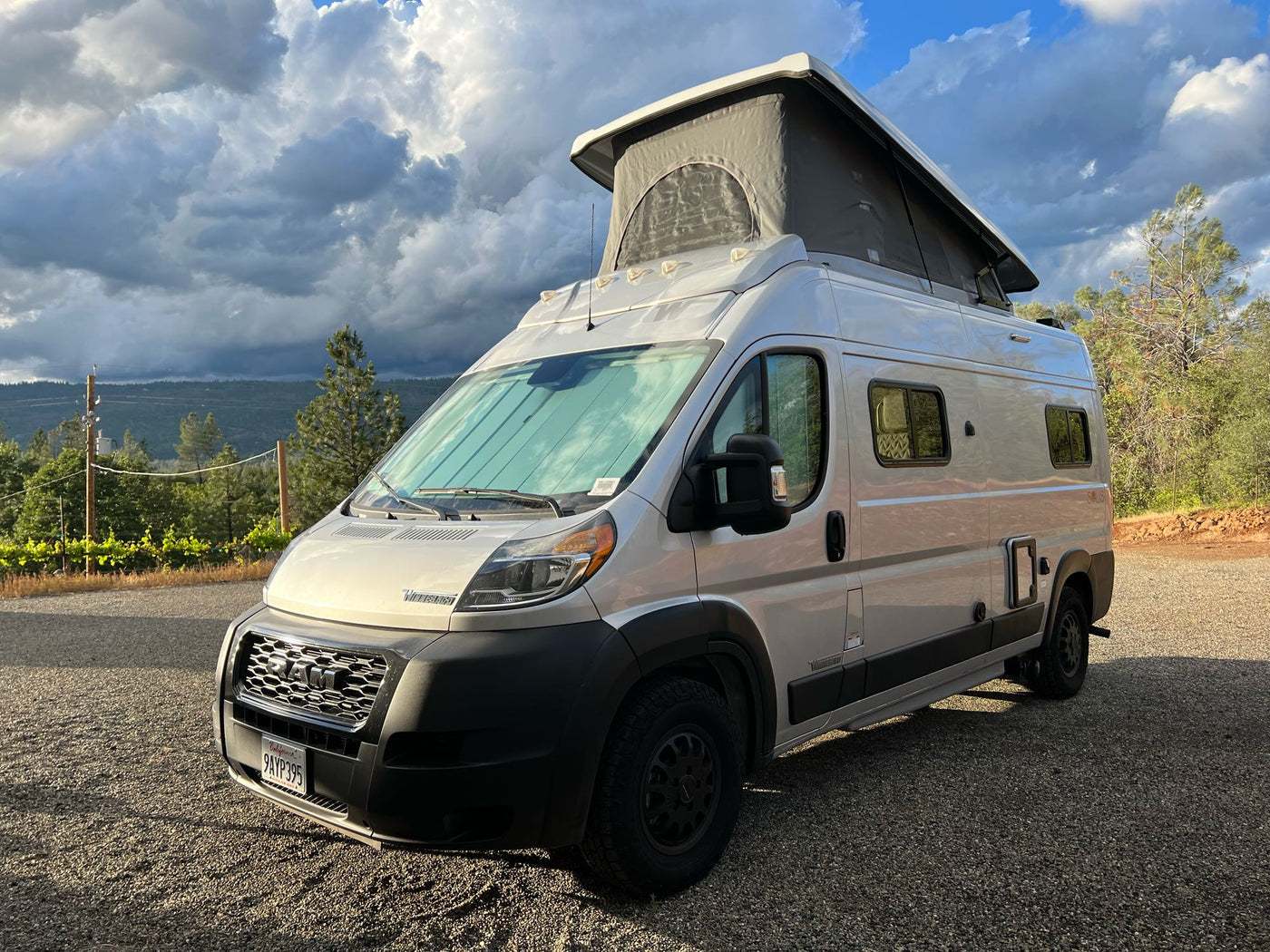  and child car seats for comfortable road trips.|Cozy rv rental interior featuring a practical kitchenette — photo 11