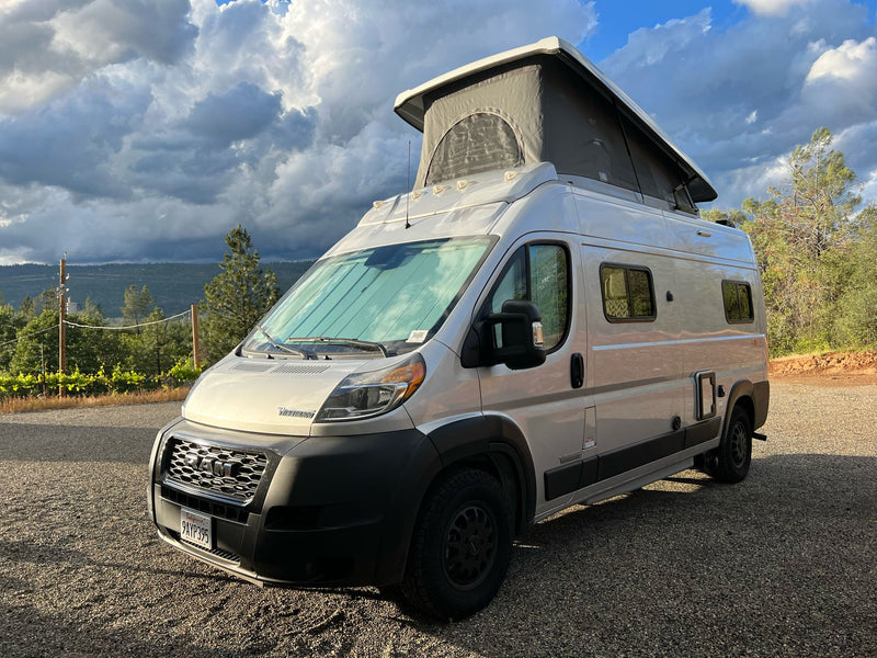  and child car seats for comfortable road trips.|Cozy rv rental interior featuring a practical kitchenette — photo 11