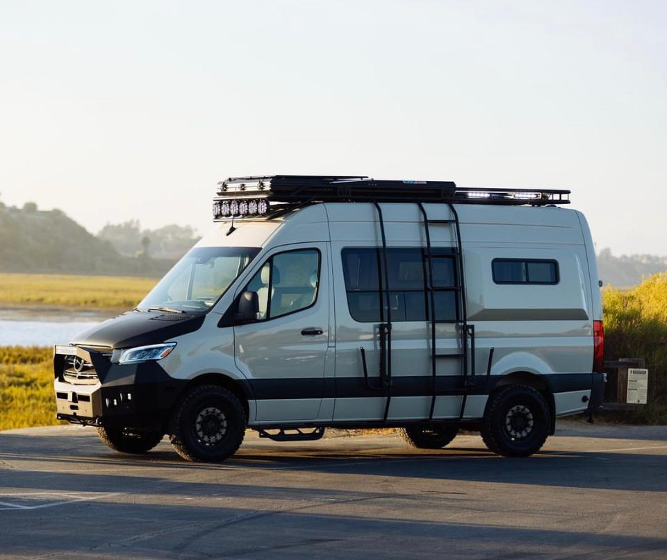 Light-colored Mercedes Sprinter camper van
