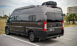 Dark gray Winnebago Solis camper van with rooftop AC, ideal for an RV rental or road trip adventure.