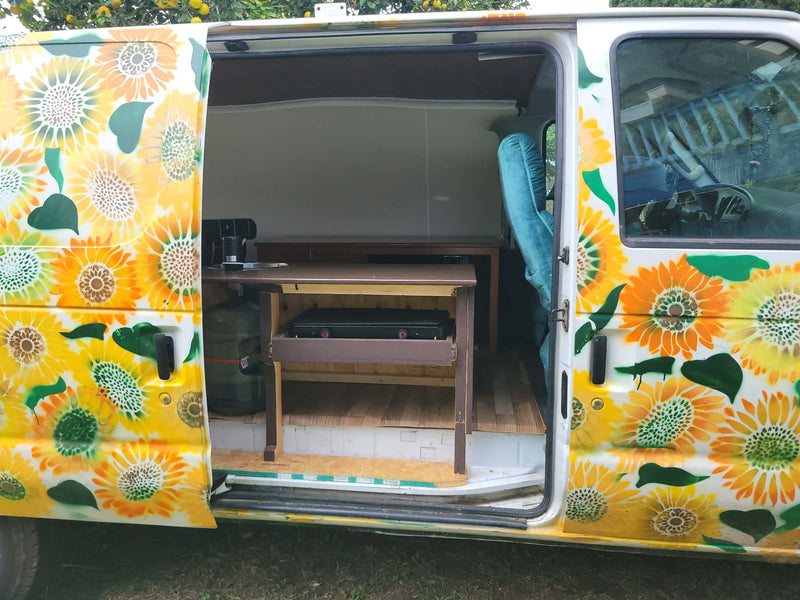  and outdoor view. Perfect for mobile living in this camper van.|Cozy RV rental interior: teal driver's seat — photo 6
