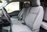 Inside a spacious grey-seated vehicle for your rv rental, showing steering wheel & outdoor scenery.