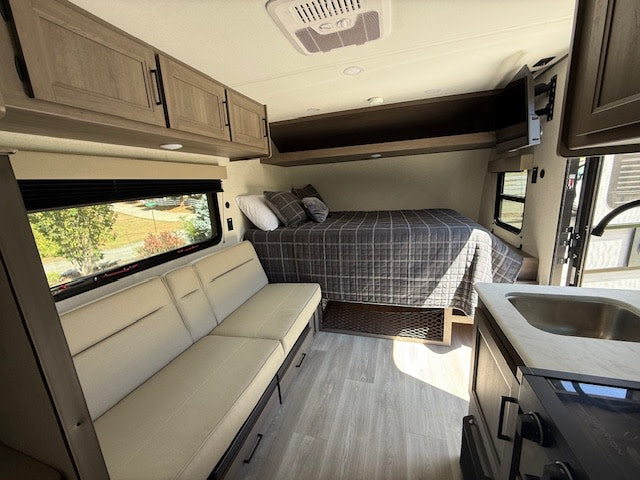  perfect for your next rv rental adventure.|Explore this modern RV rental's compact kitchen with all essentials — photo 6