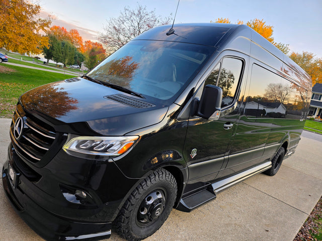 Sleek black Mercedes Sprinter camper van, equipped for adventure. An ideal RV rental for your next journey.