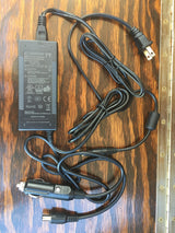 Versatile 12V AC adapter with car lighter plug, ideal for powering devices in an rv rental or camping setup.