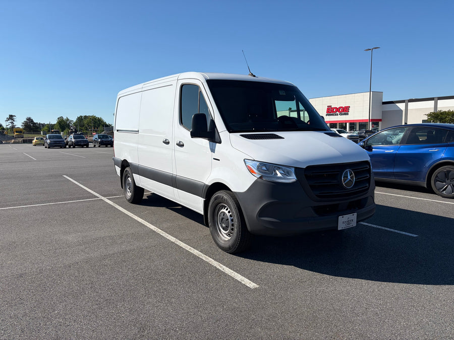  and snack box near the door.|Interior view of a modern van or RV rental cab