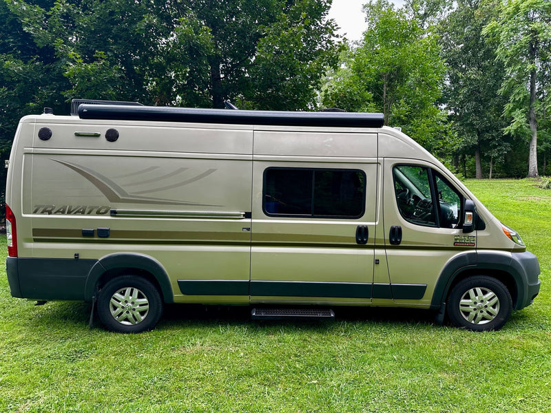Winnebago Travato camper van on grass — photo 1