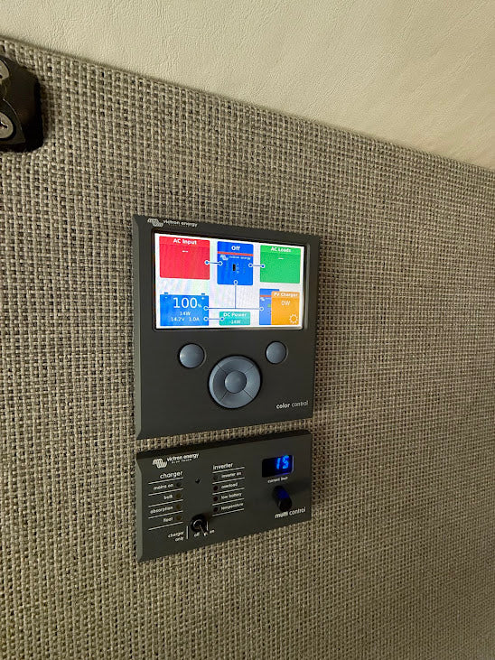Detailed power management system in an rv rental, with Victron Energy controls for battery and inverter/charger status.