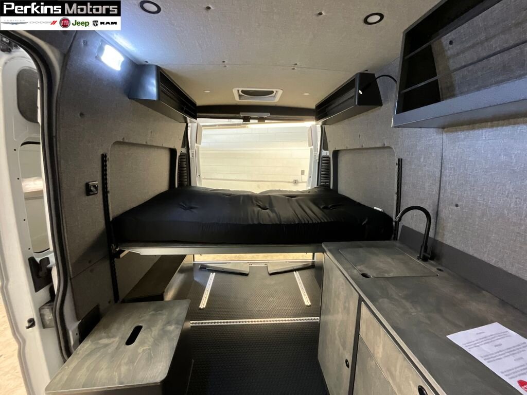  and entry steps. Ideal for your next RV rental adventure.**|Explore this spacious rv rental van conversion. Features a raised bed — photo 4
