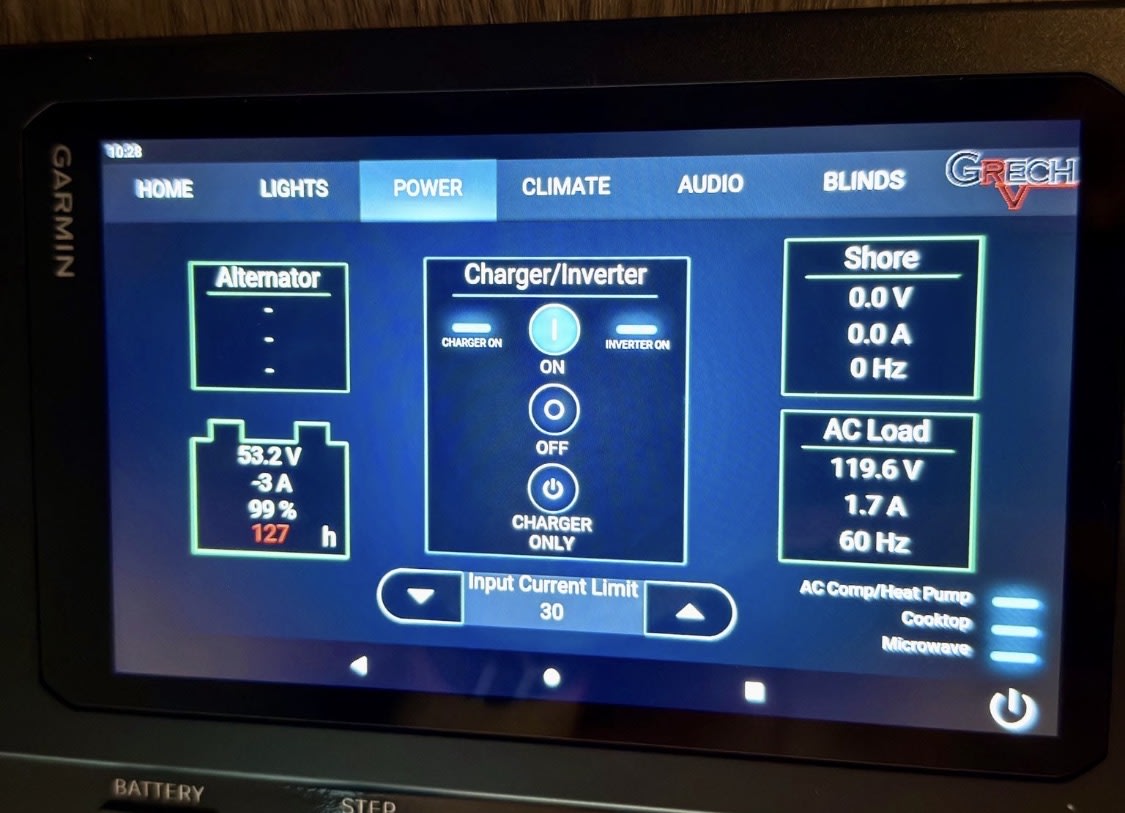  and pull-out table.|Inside a premium rv rental: compact kitchenette — photo 18