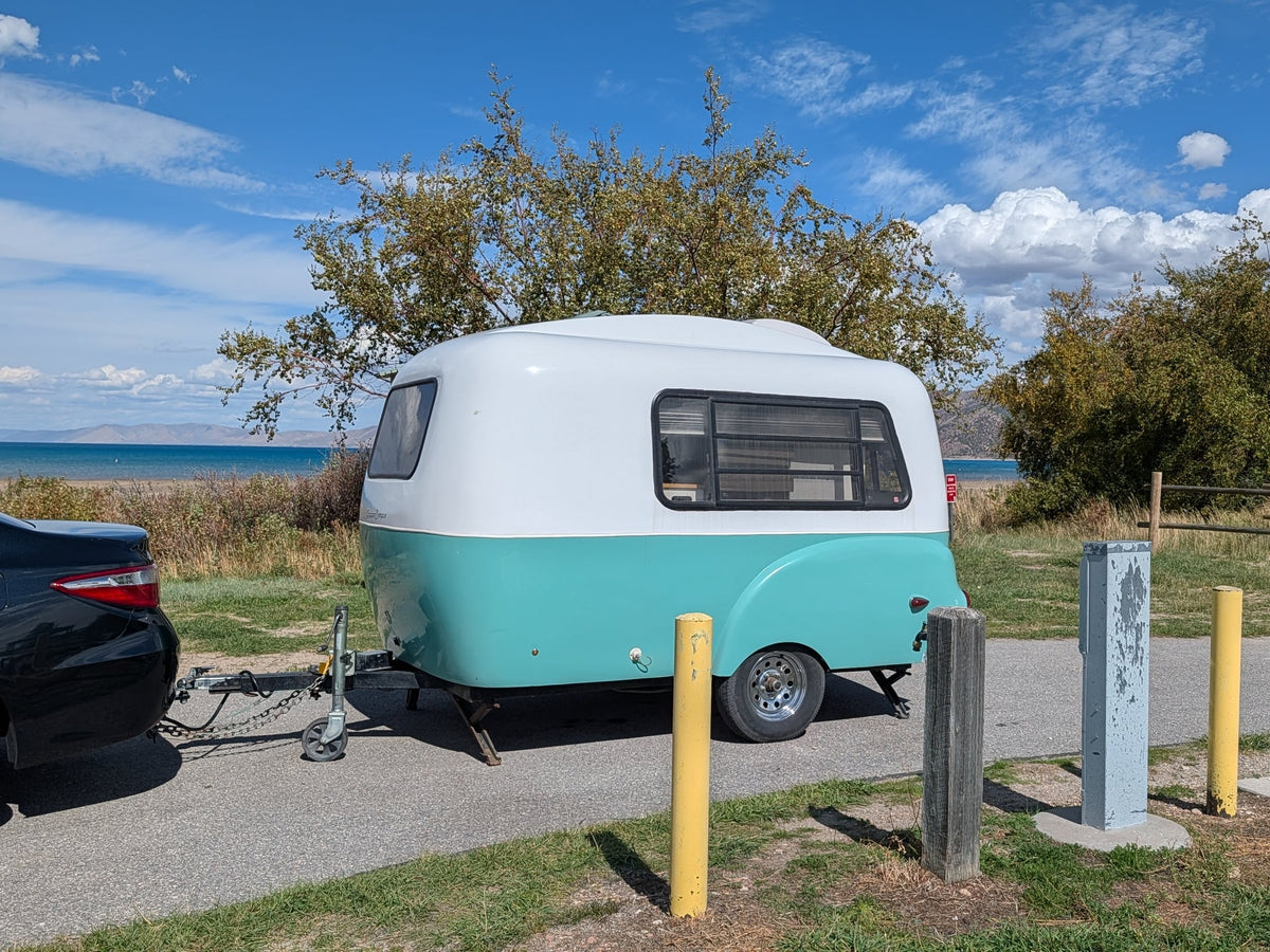 Cozy teal & white RV rental — photo 1