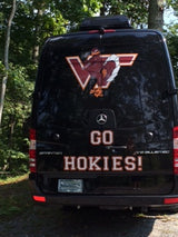 This black Mercedes Sprinter RV rental sports a large Virginia Tech Hokies VT logo and "GO HOKIES!" for spirited travel.