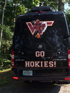 This black Mercedes Sprinter RV rental sports a large Virginia Tech Hokies VT logo and "GO HOKIES!" for spirited travel. — photo 3