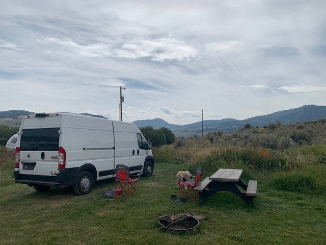  perfect for RV rental. Parked on a driveway with desert plants under a blue sky.|Bright white cargo van (Ram ProMaster) on a sunny driveway — photo 4