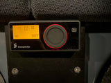 Close-up of an Eberspächer RV rental heater/thermostat. Its orange display shows 88°F and a large control knob.