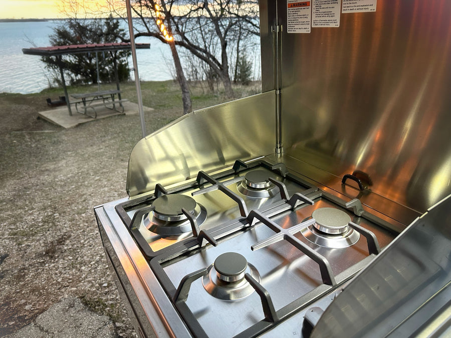  and a pop-up tent roof. Great for family trips.|Cozy RV rental camping setup at dusk