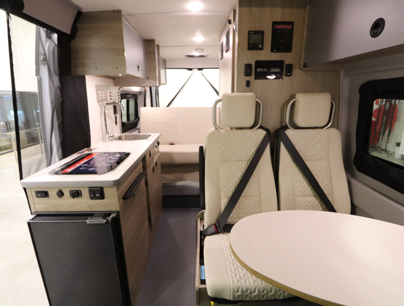  and storage. Ideal for travel.|Overhead view of a modern RV rental interior — photo 2